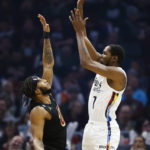 
              Brooklyn Nets forward Kevin Durant (7) shoots against Cleveland Cavaliers forward Lamar Stevens during the first half of an NBA basketball game, Monday, Dec. 26, 2022, in Cleveland. (AP Photo/Ron Schwane)
            