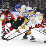 
              Buffalo Sabres right wing Tage Thompson (72) tries to skate past New Jersey Devils players during the third period of an NHL hockey game Friday, Nov. 25, 2022, in Buffalo, N.Y. (AP Photo/Joshua Bessex)
            