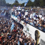 
              Soccer fans welcome home the Argentine soccer team after it won the World Cup tournament in Buenos Aires, Argentina, Tuesday, Dec. 20, 2022. (AP Photo/Victor Caivano)
            