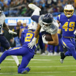 
              Tennessee Titans tight end Austin Hooper (81) is tackled by Los Angeles Chargers safety Nasir Adderley during the second half of an NFL football game in Inglewood, Calif., Sunday, Dec. 18, 2022. (AP Photo/Ashley Landis)
            