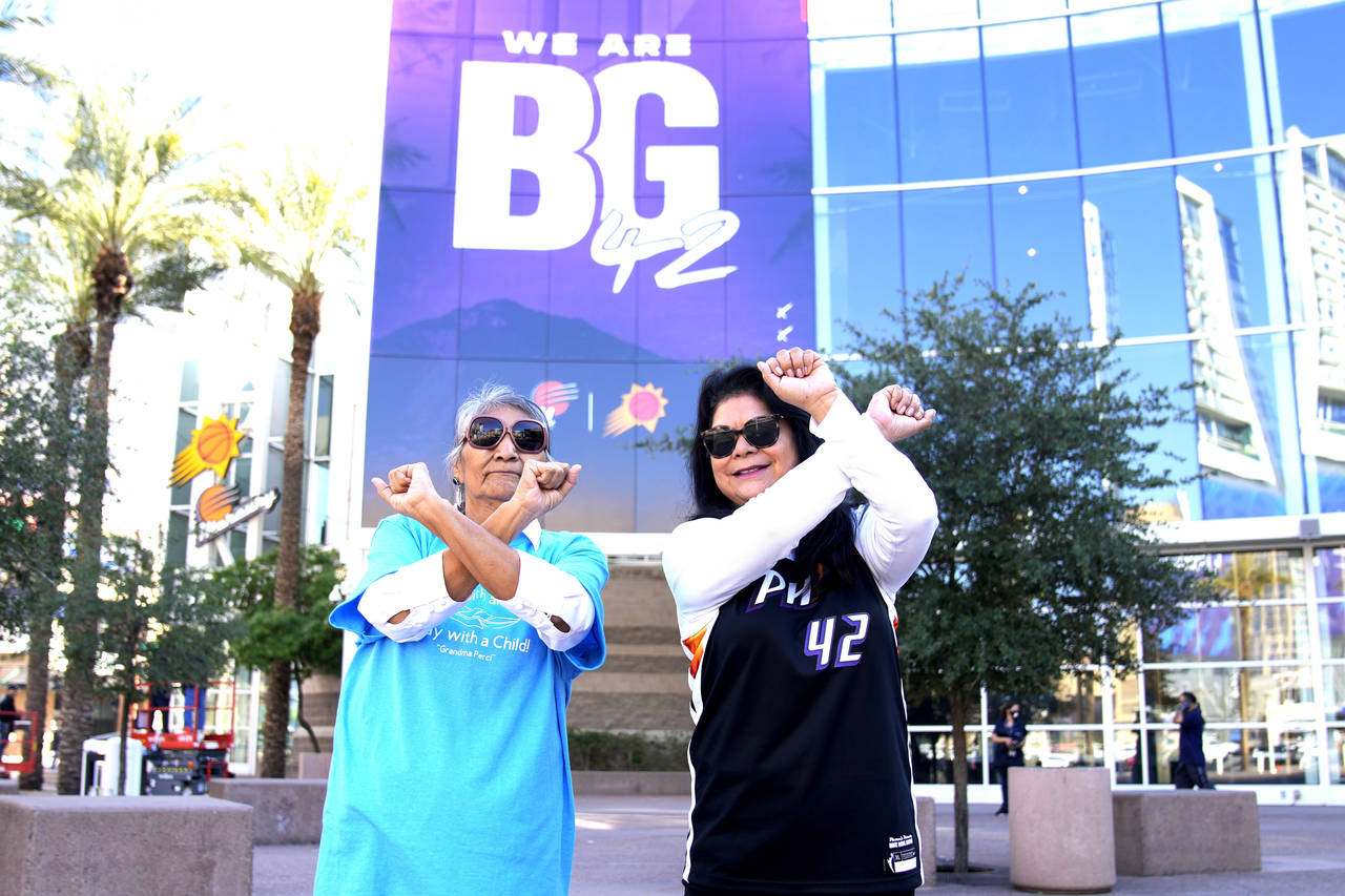 Perci Ami, left, of Laveen, Ariz., and Patty Talahongva show support for Brittney Griner, Thursday,...