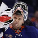 
              New York Islanders goaltender Ilya Sorokin sprays water onto his face after giving up a goal to St. Louis Blues defenseman Colton Parayko during the third period of an NHL hockey game Tuesday, Dec. 6, 2022, in Elmont, N.Y. The Blues won 7-4. (AP Photo/Adam Hunger)
            