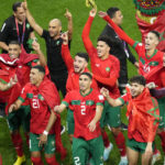 
              Morocco players celebrate at the end of the World Cup round of 16 soccer match between Morocco and Spain, at the Education City Stadium in Al Rayyan, Qatar, Tuesday, Dec. 6, 2022. (AP Photo/Ricardo Mazalan)
            