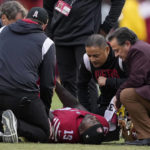 
              San Francisco 49ers wide receiver Deebo Samuel, bottom, is checked on before being carted off during the first half of an NFL football game against the Tampa Bay Buccaneers in Santa Clara, Calif., Sunday, Dec. 11, 2022. (AP Photo/Tony Avelar)
            