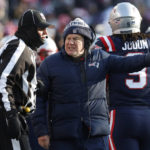 
              New England Patriots head coach Bill Belichick, center, speaks with an official during the first half of an NFL football game against the Cincinnati Bengals, Saturday, Dec. 24, 2022, in Foxborough, Mass. (AP Photo/Michael Dwyer)
            