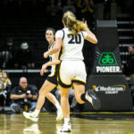 
              Iowa guard Caitlin Clark (22) smiles after making a basket during an NCAA college basketball game against Dartmouth, Wednesday, Dec. 21, 2022, at Carver-Hawkeye Arena in Iowa City, Iowa. (Joseph Cress/Iowa City Press-Citizen via AP)
            
