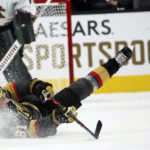 
              Vegas Golden Knights right wing Mark Stone (61) reaches for the puck after falling to the ice during the first period of an NHL hockey game against the Arizona Coyotes Wednesday, Dec. 21, 2022, in Las Vegas. (AP Photo/Chase Stevens)
            