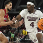 
              Mississippi State guard Cameron Matthews (4) drives up court against Nicholls State forward Marek Nelson (0) during the first half of an NCAA college basketball game, in Starkville, Miss., Saturday, Dec. 17, 2022. (AP Photo/Rogelio V. Solis)
            