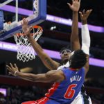 
              Orlando Magic center Wendell Carter Jr. (34) blocks a shot attempt by Detroit Pistons guard Hamidou Diallo (6) during the first half of an NBA basketball game Wednesday, Dec. 28, 2022, in Detroit. (AP Photo/Duane Burleson)
            