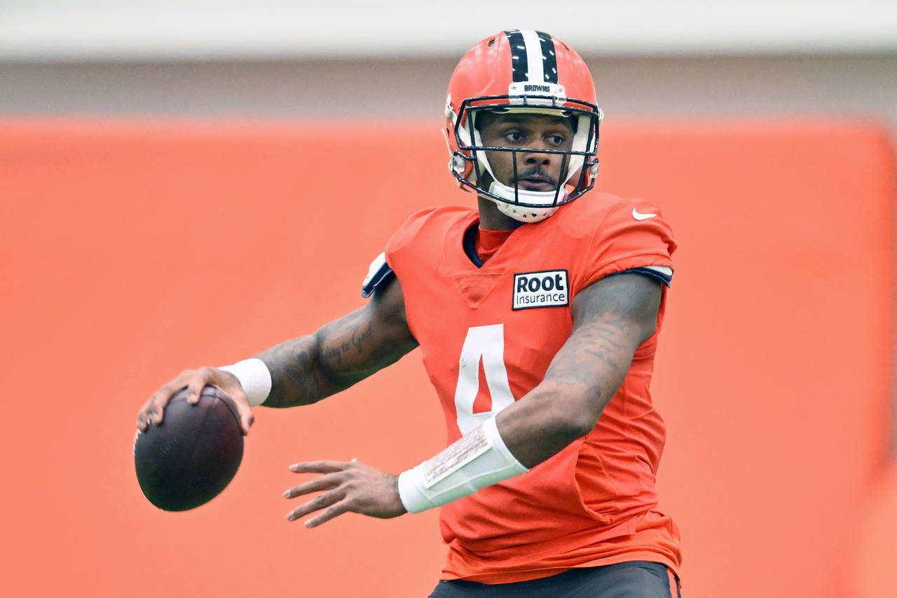 Cleveland Browns quarterback Deshaun Watson looks to pass during an NFL football practice at the te...