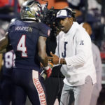 
              Jackson State head coach Deion Sanders, right, speaks with cornerback De'Jahn Warren (4) who comes off the field during the second half of the Southwestern Athletic Conference championship NCAA college football game against Southern, Saturday, Dec. 3, 2022, in Jackson, Miss. (AP Photo/Rogelio V. Solis)
            