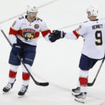 
              Florida Panthers Carter Verhaeghe, left, celebrates with Sam Bennett (9) after scoring a goal against the New Jersey Devils during the third period of an NHL hockey game, Saturday Dec. 17, 2022, in Newark, N.J. (AP Photo/Noah K. Murray)
            