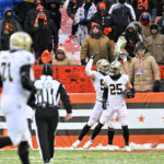 
              Teammates congratulate New Orleans Saints safety Daniel Sorensen (25) after he intercepted a pass intended for Cleveland Browns wide receiver David Bell during the second half of an NFL football game, Saturday, Dec. 24, 2022, in Cleveland. (AP Photo/David Richard)
            