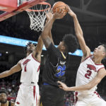 
              Arkansas defenders Ricky Council IV (1) and Trevon Brazile (2) go up to block the shot of San Jose State forward Robert Vaihola (22) during the first half of an NCAA college basketball game Saturday, Dec. 3, 2022, in Fayetteville, Ark. (AP Photo/Michael Woods)
            