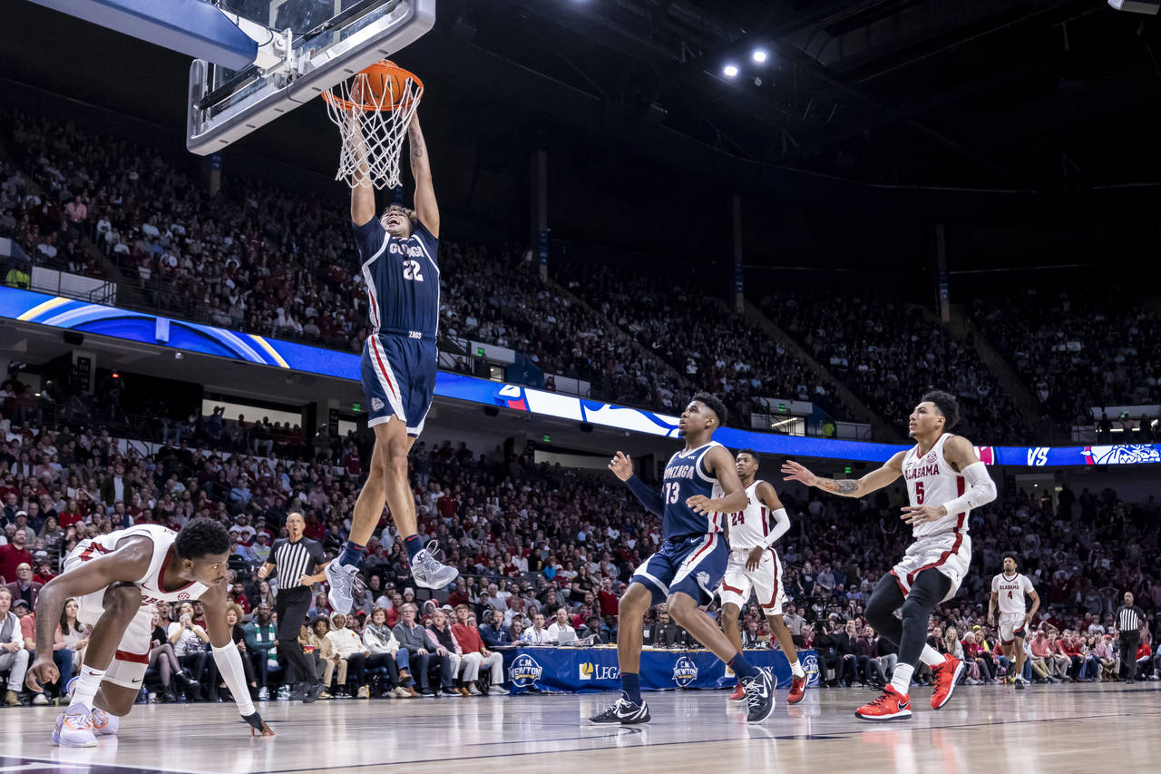 Gonzaga forward Anton Watson (22) gets loose for a dunk against Alabama during the second half of a...