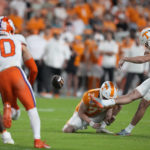 
              Tennessee' Chase McGrath (40) kicks an extra point from the hold of Paxton Brooks (37) during the first half of the team's Orange Bowl NCAA college football game against Clemson, Friday, Dec. 30, 2022, in Miami Gardens, Fla. (AP Photo/Rebecca Blackwell)
            