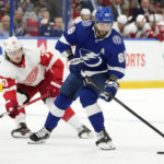 
              Tampa Bay Lightning right wing Nikita Kucherov (86) moves around Detroit Red Wings center Oskar Sundqvist (70) during the second period of an NHL hockey game Tuesday, Dec. 6, 2022, in Tampa, Fla. (AP Photo/Chris O'Meara)
            