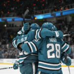 
              San Jose Sharks left wing Oskar Lindblom, left, celebrates with teammates after scoring against the Minnesota Wild during the second period of an NHL hockey game in San Jose, Calif., Thursday, Dec. 22, 2022. (AP Photo/Godofredo A. Vásquez)
            