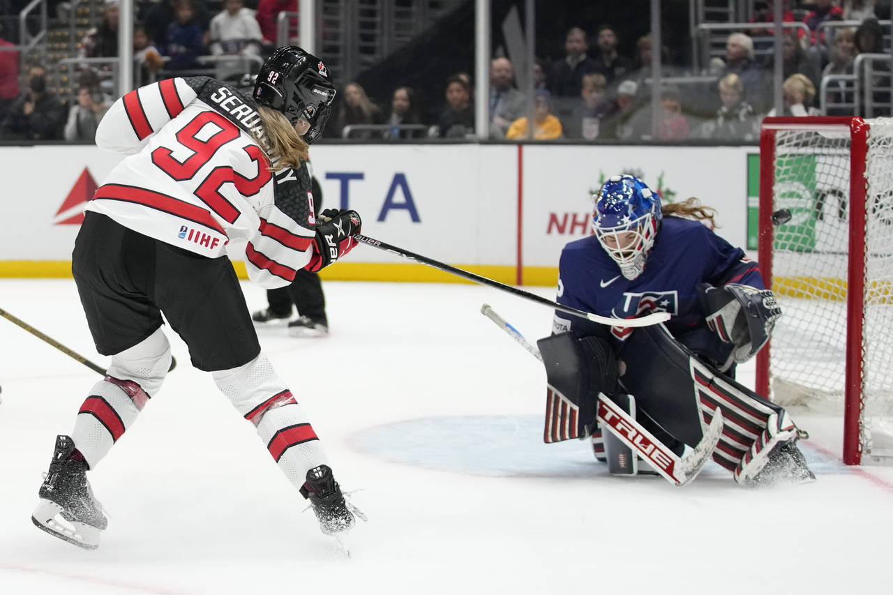Canada's Danielle Serdchny (92) scores against United States goal tender Nicole Hensley (29) during...
