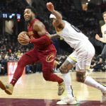 
              Cleveland Cavaliers guard Donovan Mitchell drives against Utah Jazz guard Jordan Clarkson during the second half of an NBA basketball game, Monday, Dec. 19, 2022, in Cleveland. (AP Photo/Nick Cammett)
            