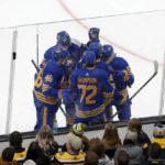 
              Buffalo Sabres player surround Alex Tuch after he scored a goal against the Boston Bruins during the second period of an NHL hockey game, Saturday, Dec. 31, 2022, in Boston. (AP Photo/Mary Schwalm)
            