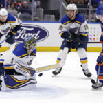 
              St. Louis Blues goaltender Thomas Greiss makes a save in front of New York Islanders right wing Simon Holmstrom (10) during the second period of an NHL hockey game Tuesday, Dec. 6, 2022, in Elmont, N.Y. (AP Photo/Adam Hunger)
            