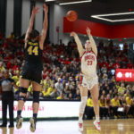 
              Ohio State forward Rebeka Mikulášiková, right, shoots in front of Michigan forward Cameron Williams during the second half of an NCAA college basketball game in Columbus, Ohio, Saturday, Dec. 31, 2022. Ohio State won 66-57. (AP Photo/Paul Vernon)
            