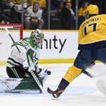 
              Dallas Stars goaltender Jake Oettinger (29) blocks a shot by Nashville Predators center Mark Jankowski (17) during the second period of an NHL hockey game Tuesday, Dec. 27, 2022, in Nashville, Tenn. (AP Photo/Mark Zaleski)
            