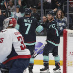 
              Seattle Kraken center Jaden Schwartz (17) celebrates after his goal with right wing Jordan Eberle as Washington Capitals goaltender Darcy Kuemper looks on during the second period of an NHL hockey game Thursday, Dec. 1, 2022, in Seattle. (AP Photo/Jason Redmond)
            
