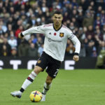 
              FILE - Manchester United's Cristiano Ronaldo runs with the ball during the English Premier League soccer match between Aston Villa and Manchester United at Villa Park in Birmingham, England, on Nov. 6, 2022. Less than two weeks after his great rival Lionel Messi lifted the World Cup, Cristiano Ronaldo has completed a move to Saudi Arabian club Al Nassr and likely signalled the end of his career in elite club soccer. In agreeing a contract until 2025, the five-time Ballon d’Or winner has ended speculation about his future after having his contract terminated by Manchester United last month. (AP Photo/Rui Vieira)
            