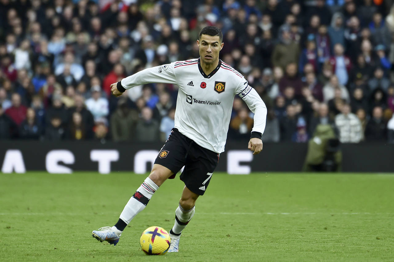 FILE - Manchester United's Cristiano Ronaldo runs with the ball during the English Premier League s...