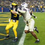 
              TCU linebacker Dee Winters (13) runs back an interception for a touchdown as Michigan quarterback J.J. McCarthy (9) defends during the second half of the Fiesta Bowl NCAA college football semifinal playoff game, Saturday, Dec. 31, 2022, in Glendale, Ariz. (AP Photo/Ross D. Franklin)
            