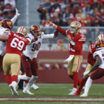 
              San Francisco 49ers quarterback Brock Purdy (13) throws to a receiver as he is pressured by Washington Commanders defensive end Montez Sweat (90) in the second half of an NFL football game, Saturday, Dec. 24, 2022, in Santa Clara, Calif. (AP Photo/Jed Jacobsohn)
            