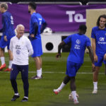 
              France's head coach Didier Deschamps smiles during the training session at the Jassim Bin Hamad stadium in Doha, Qatar, Friday, Dec. 16, 2022. France will play against Argentina during their World Cup final soccer match on Dec. 18. (AP Photo/Petr David Josek)
            