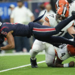 
              Houston Texans safety Jalen Pitre (5) is upended after intercepting a pass by Cleveland Browns quarterback Deshaun Watson (4) during the first half of an NFL football game between the Cleveland Browns and Houston Texans in Houston, Sunday, Dec. 4, 2022,. (AP Photo/Eric Gay)
            