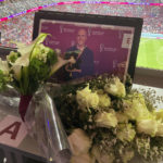 
              A tribute to journalist Grant Wahl is seen on his previously assigned seat at the World Cup quarterfinal soccer match between England and France, at the Al Bayt Stadium in Al Khor, Qatar, Saturday, Dec. 10, 2022. Wahl, one of the most well-known soccer writers in the United States, died early Saturday Dec. 10, 2022 while covering the World Cup match between Argentina and the Netherlands. (AP Photo/Graham Dunbar)
            