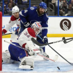 
              Montreal Canadiens goaltender Jake Allen (34) stops a shot by Tampa Bay Lightning left wing Pat Maroon (14) during the second period of an NHL hockey game Wednesday, Dec. 28, 2022, in Tampa, Fla. (AP Photo/Chris O'Meara)
            