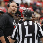
              North Carolina State head coach Dave Doeren argues a call with line judge Matt Dornan during the first half of the Duke's Mayo Bowl NCAA college football game against Maryland in Charlotte, N.C., Friday, Dec. 30, 2022. (AP Photo/Nell Redmond)
            