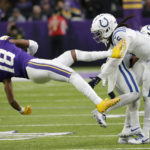 
              Minnesota Vikings wide receiver Justin Jefferson (18) is tackled by Indianapolis Colts cornerback Stephon Gilmore (5) during the second half of an NFL football game, Saturday, Dec. 17, 2022, in Minneapolis. (AP Photo/Andy Clayton-King)
            