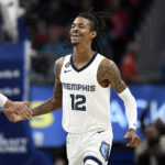 
              Memphis Grizzlies guard Ja Morant reacts after dunking against the Detroit Pistons during the second half of an NBA basketball game, Sunday, Dec. 4, 2022, in Detroit. (AP Photo/Jose Juarez)
            