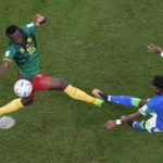 
              Cameroon's Tolo Nouhou tries to block a shot from Brazil's Fred, right, during the World Cup group G soccer match between Cameroon and Brazil, at the Lusail Stadium in Lusail, Qatar, Friday, Dec. 2, 2022. (AP Photo/Thanassis Stavrakis)
            