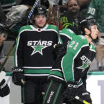 
              Dallas Stars' Jason Robertson (21), Joe Pavelski (16) and Miro Heiskanen (4) skate to the bench after celebrating a goal by Robertson during the first period of the team's NHL hockey game against the Anaheim Ducks on Thursday, Dec. 1, 2022, in Dallas. (AP Photo/Tony Gutierrez)
            