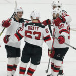 
              New Jersey Devils left wing Jesper Bratt (63) is congratulated by his teammates after scoring a goal during first period of an NHL hockey game against the Florida Panthers, Wednesday, Dec. 21, 2022, in Sunrise, Fla. (AP Photo/Marta Lavandier)
            