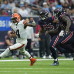 
              Cleveland Browns quarterback Deshaun Watson (4) evades Houston Texans guard Kenyon Green (59) and defensive tackle Maliek Collins during the second half of an NFL football game between the Cleveland Browns and Houston Texans in Houston, Sunday, Dec. 4, 2022. (AP Photo/Eric Gay)
            