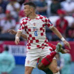 
              Croatia's Ivan Perisic, top, vies for a ball with Morocco's Achraf Hakimi during the World Cup group F soccer match between Morocco and Croatia, at the Al Bayt Stadium in Al Khor , Qatar, Wednesday, Nov. 23, 2022. (AP Photo/Thanassis Stavrakis)
            