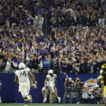 
              Fans cheer as TCU wide receiver Quentin Johnston (1) runs in for a touchdown during the second half of the Fiesta Bowl NCAA college football semifinal playoff game against Michigan, Saturday, Dec. 31, 2022, in Glendale, Ariz. (AP Photo/Ross D. Franklin)
            