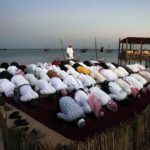 
              Men pray in Katara beach, Doha, Qatar, Monday, Nov. 28, 2022. (AP Photo/Jorge Saenz)
            
