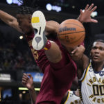 
              Indiana Pacers guard Bennedict Mathurin (00) vies for a rebound against Cleveland Cavaliers forward Isaac Okoro (35) during the first half of an NBA basketball game in Indianapolis, Thursday, Dec. 29, 2022. (AP Photo/AJ Mast)
            