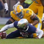 
              Jackson State defensive lineman Justin Ragin (92) recovers a Southern University fumble during the first half of the Southwestern Athletic Conference championship NCAA college football game Saturday, Dec. 3, 2022, in Jackson, Miss. (AP Photo/Rogelio V. Solis)
            