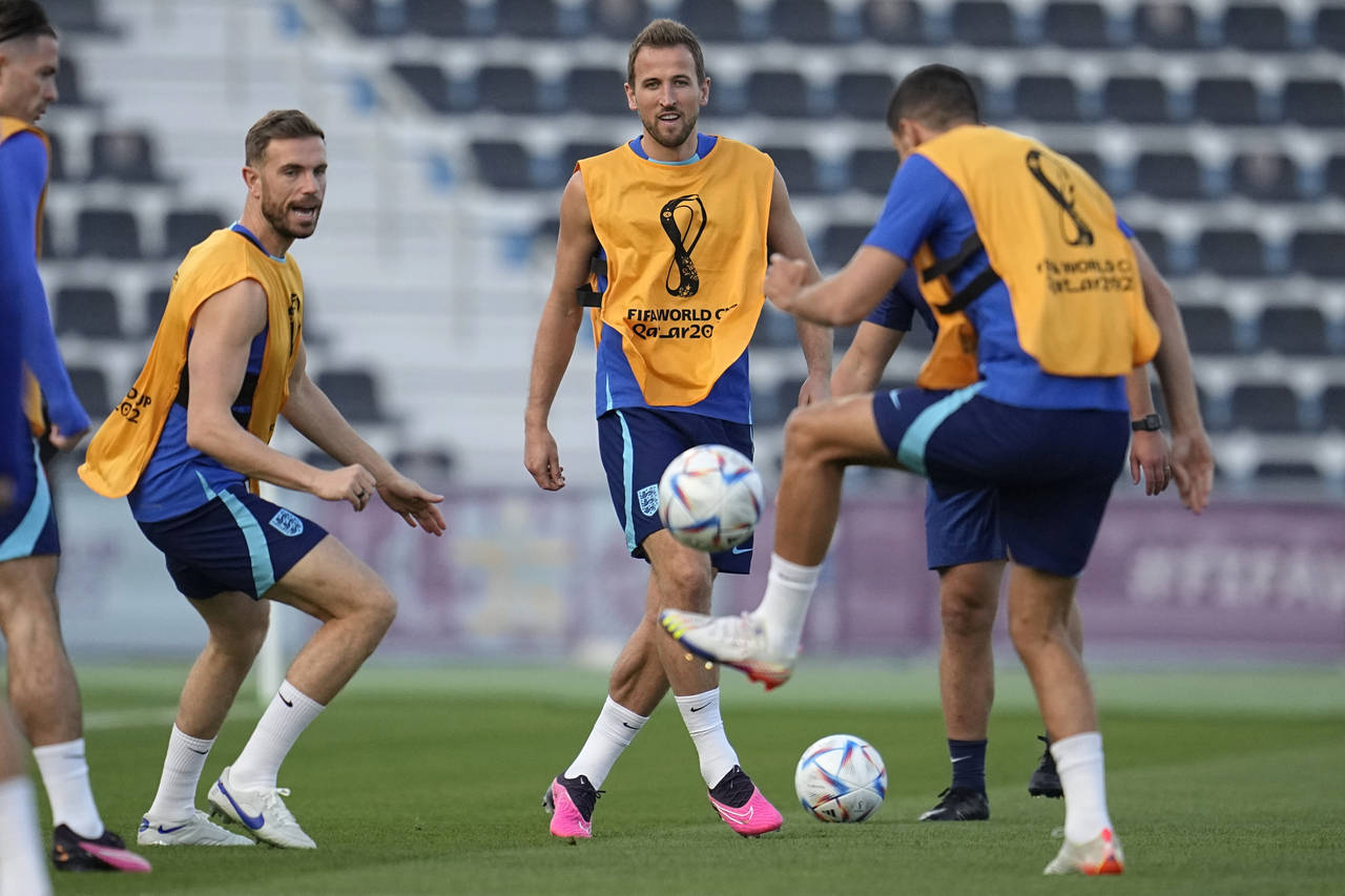 England's Harry Kane, middle, takes part in drills during an official training session on the eve o...